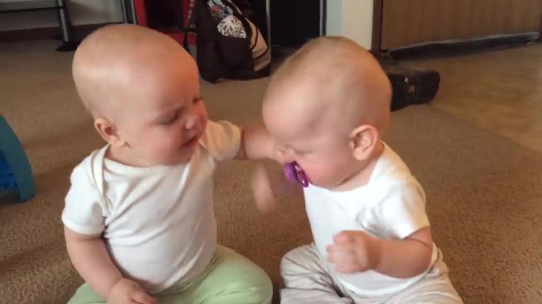 Pacifier Showdown: Adorable Twin Baby Girls Engage in Hilarious Battle !